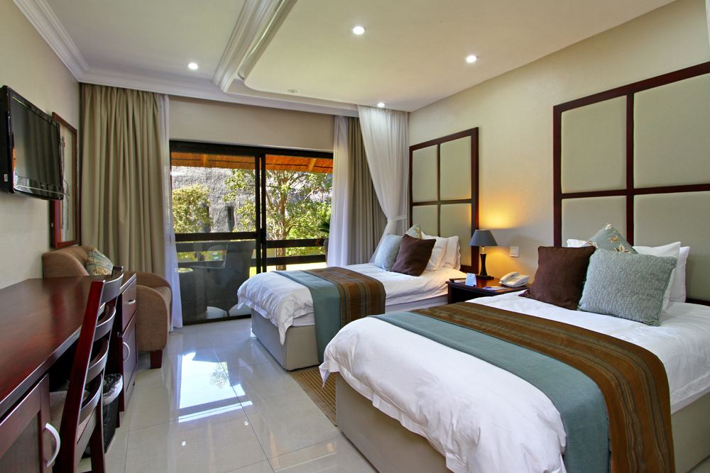 A'Zambezi River Lodge: Standardzimmer mit Einzelbetten A'Zambezi River Lodge, Doppelzimmer, Gästebett, Rainbow Toursim Group, Sambesi, Victoria Falls, Viktoriafälle, Afrikarma, Afrikarma Safaris, Afrikarma.de