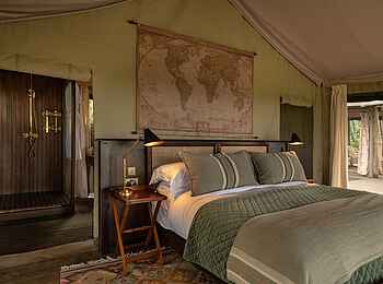 Paradise Plains Camp: Bett in Zeltsuite