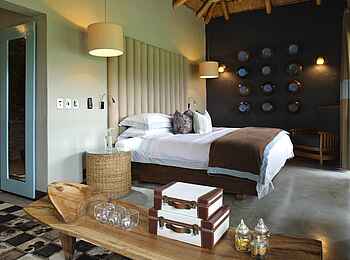 &Beyond Phinda Zuka Lodge: Schlafzimmer der Gästechalets &Beyond Phinda Zuka Lodge: Schlafzimmer der Gästechalets