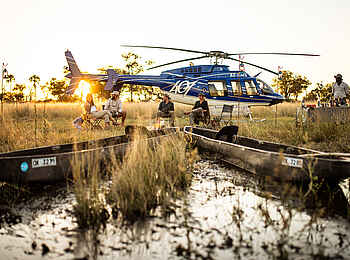 Kweene River Camp: Helikopter und Mokoro