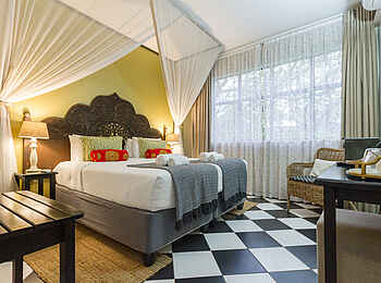 528 Victoria Falls Guesthouse: Ein Deluxe Zimmer mit Fliesen im Schachbrettmuster