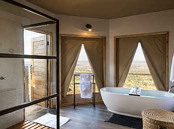 Lemala Mpingo Ridge Lodge: Luxuriöses Badezimmer Lemala Mpingo Ridge Lodge: Luxuriöses Badezimmer