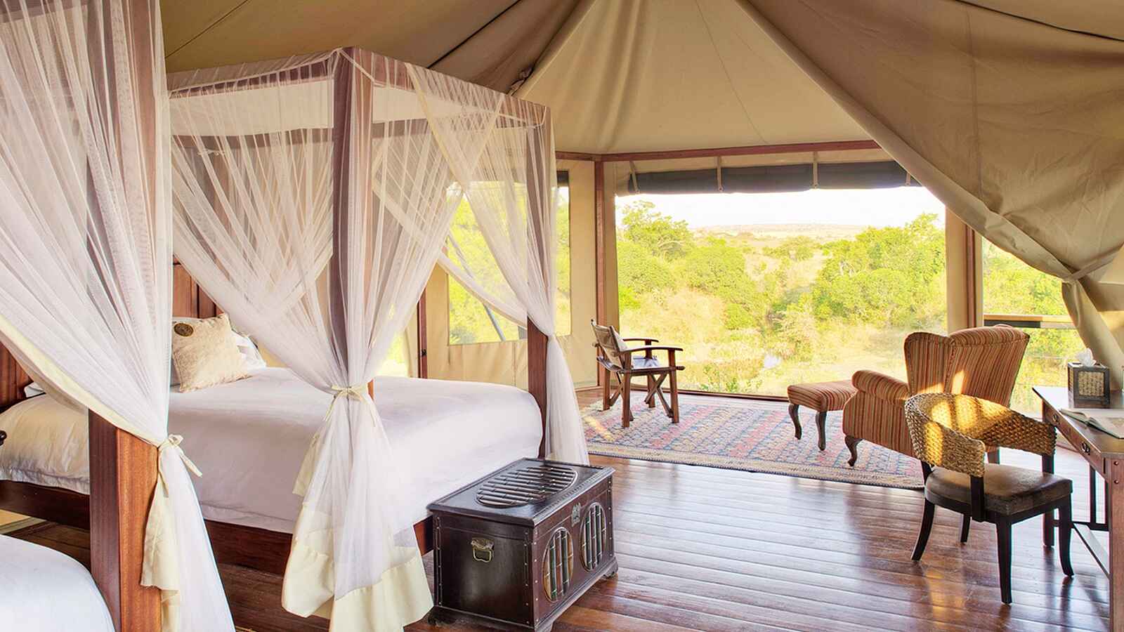 Olare Mara Kempinski: Gästebett mit Moskitonetz Olare Mara Kempinski: Gästebett mit Moskitonetz