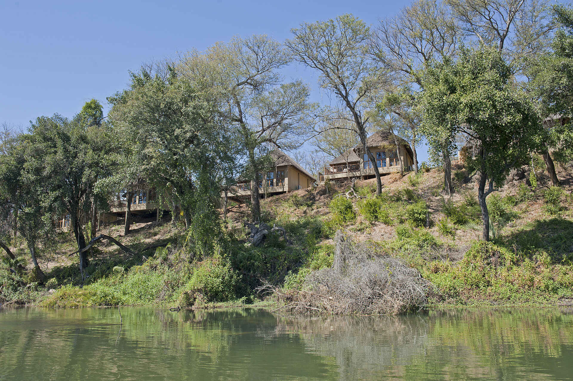 africa, afrika, bagani area, buffalo game park, buffalo game reserve, caprivi, caprivi strip, caprivi-streifen, divava, divava okavango lodge, divava okavango lodge & spa, divava okavango lodge and spa, divundu, erholung, kavango river region, mahango, mahango national park, mahango nationalpark, namibia, nordnamibia, nordostnamibia, north-eastern namibia, northern namibia, okavango, okavango river, popa falls, popa wasserfall, resdest, reservation destination, safari, southern africa, spa, südliches afrika, urlaub, west-caprivi, western caprivi, anlage, ansicht, chalet, fluss, gästechalet, guest room, wasser