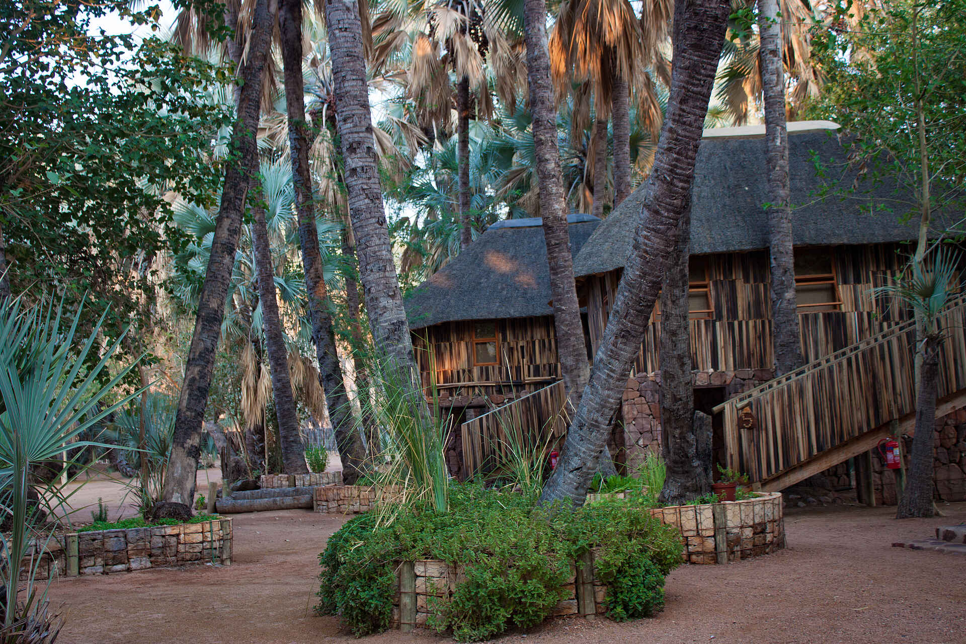 Cunene River, Epupa, Epupa Falls Lodge, Epupa Falls Lodge Chalets, Epupa Waterfall, Waterfall, Epupa Falls, Kaokoland, Kunene River, Chalets, Palmen, Afrikarma, Afrikarma Safaris, Afrikarma Safaris – Wildnis. Hautnah., afrikarma.de