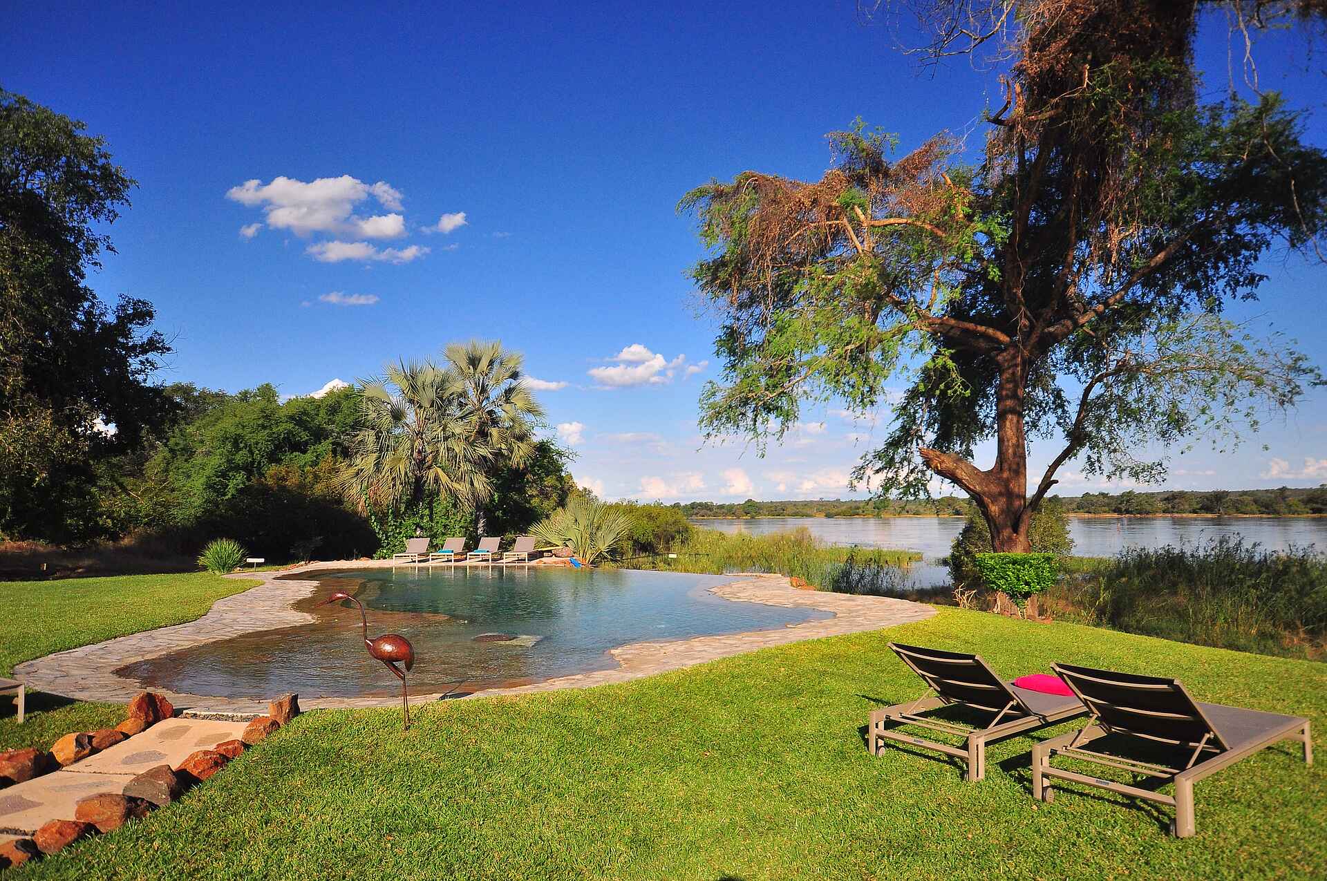 The River Farmhouse: Gartenanlage africa, afrikarma, all inclusive, amy lea, babysitting, bilder, bildergallerie, Birding, buchen, buchung, charmaine brogan, familie, familien, fluss, gavin whyte, gruppe, haus, information, informieren, john leader, kinder, kleingruppe, Krokodil, michael voack, nachhaltigkeit, Nilpferd, privathaus, reise, reisen, reiseveranstalter, safari, sambesi, sambia, south zambia, southern Zambia, süd-sambia, swimming pool, tessa prior, the river farmhouse, urlaub, victoria falls, Victoria Falls National Park, Victoria Falls Nationalpark, viktoriafälle, Vögel, vollpension, wasser, wasserfall, waterberry lodge, www.afrikarma.de, zambezi, zambia, ausblick, aussicht, central facilities, garten, gartenanlage, landschaft, main area, zentrale einrichtungen