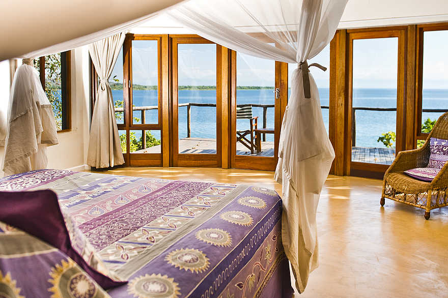 Pumulani Lodge: Doppelbett mit Moskitonetz Pumulani Lodge: Doppelbett mit Moskitonetz