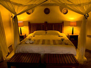 Leopard Lodge: Doppelbett mit Moskitonetz