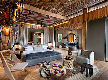 andBeyond Grumeti Serengeti River Lodge: Das Schlafzimmer einer Suite andBeyond Grumeti Serengeti River Lodge: Das Schlafzimmer einer Suite